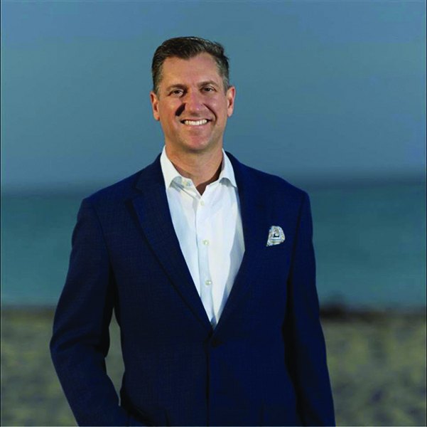 Rabbi Feivel Strauss of Tamid Palm Beach standing by the ocean