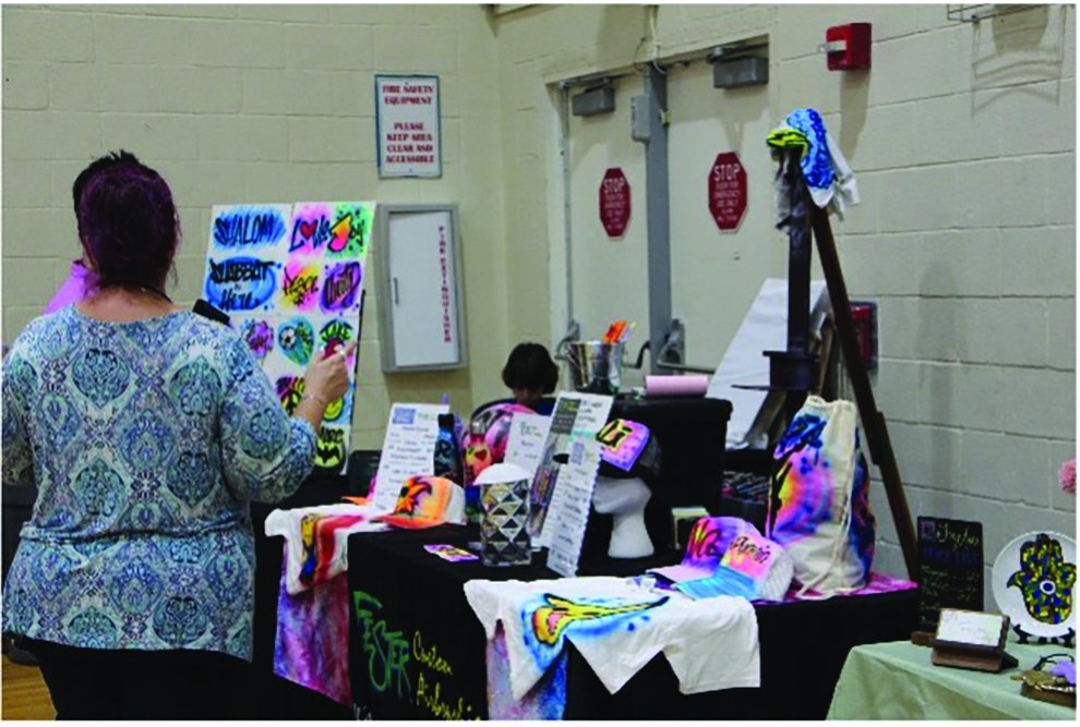 Vendor table with handmade goods at the Mandel JCC Jewbilee
