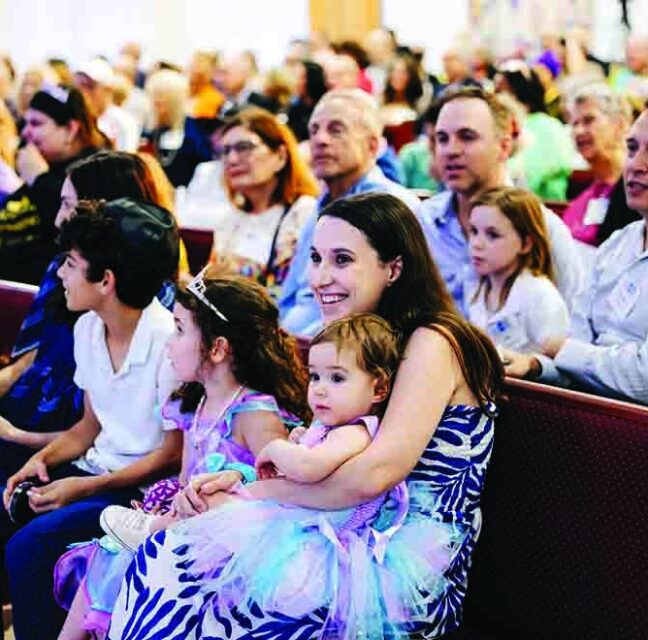 Families seated in the pews at Temple Israel’s new West Palm Beach campus