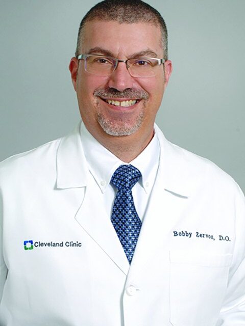 Dr. Xaralambos “Bobby” Zervos in a Cleveland Clinic white coat