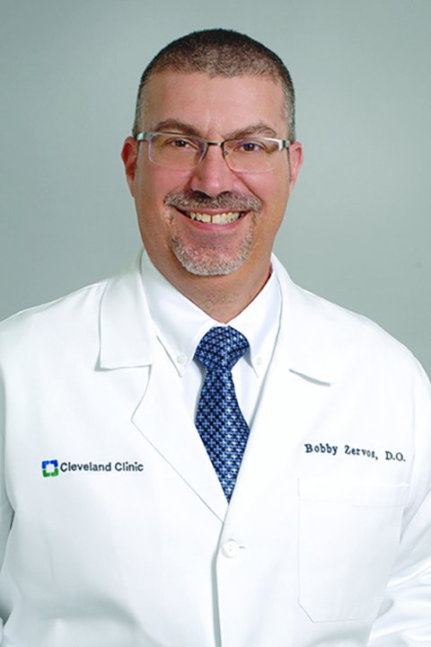 Dr. Xaralambos “Bobby” Zervos in a Cleveland Clinic white coat