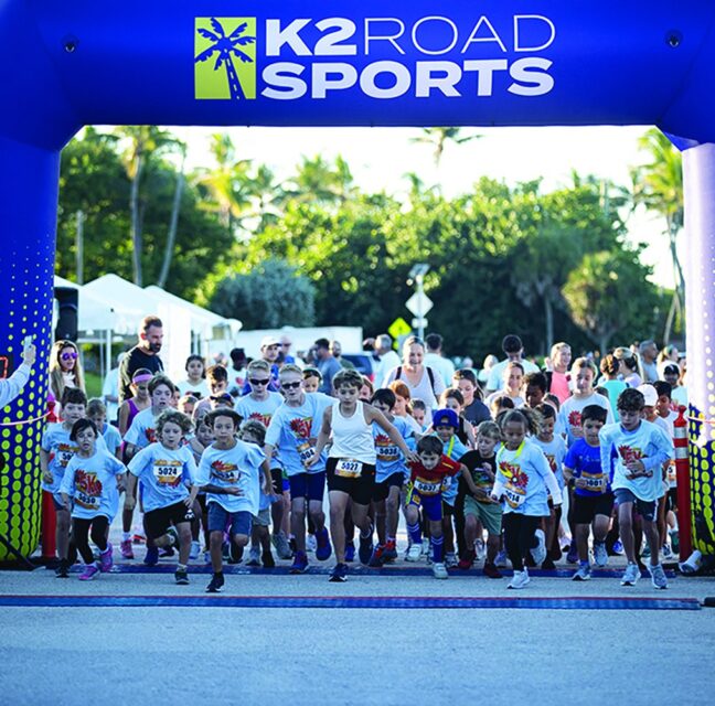 Children racing from the start arch at the Zoe Loren 5K kids dash