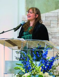 Cantorial soloist Jessy Wald singing at the Temple Beth Am bimah