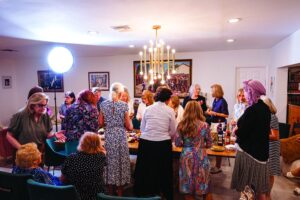 Women mingling at Rebbetzin Sara Krinsky's birthday gathering