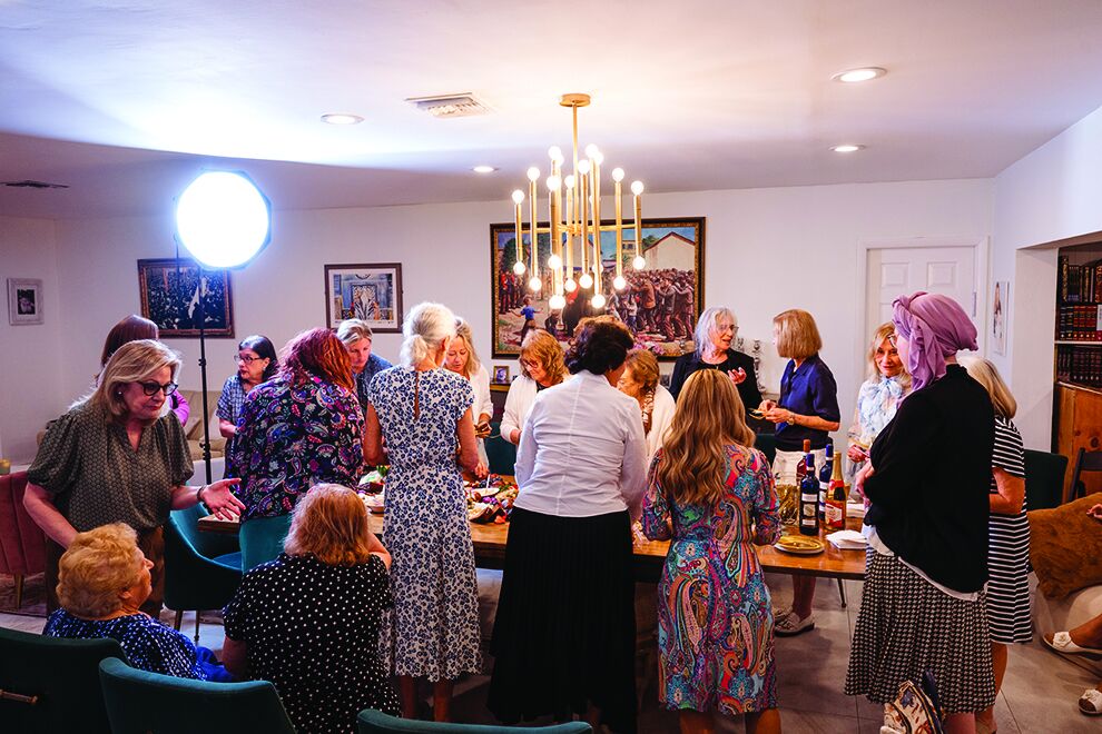 Women mingling at Rebbetzin Sara Krinsky's birthday gathering