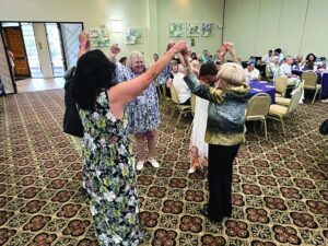 Holocaust survivors dancing at the Alpert JFS High Holy Day celebration