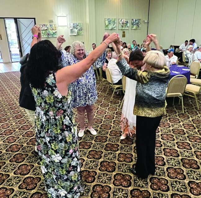 Holocaust survivors dancing at the Alpert JFS High Holy Day celebration