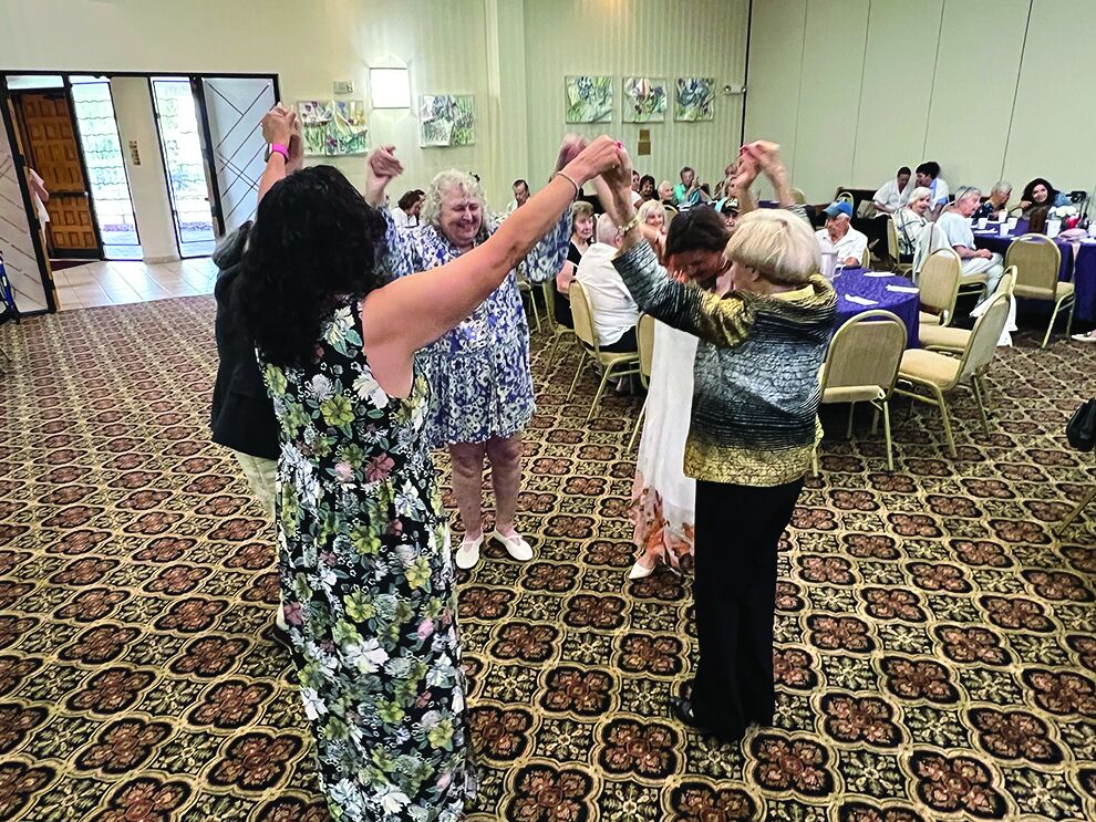 Holocaust survivors dancing at the Alpert JFS High Holy Day celebration