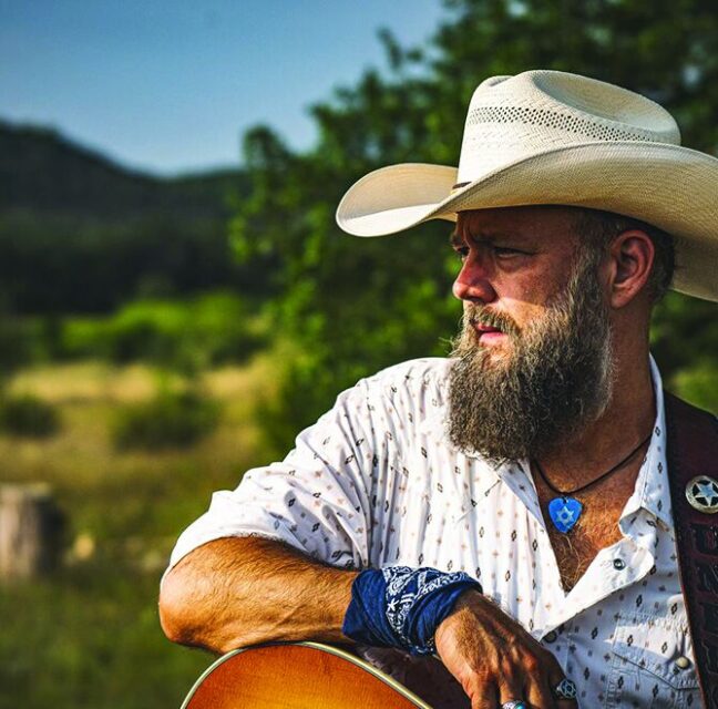 Joe Buchanan, Texas-born Jewish country music artist, with his guitar